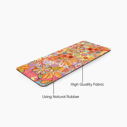 Floral desk mat with vibrant orange, pink, and yellow patterns, natural rubber base, high quality fabric