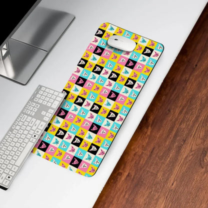 Colorful anime-themed desk mat on white workspace with keyboard and mouse