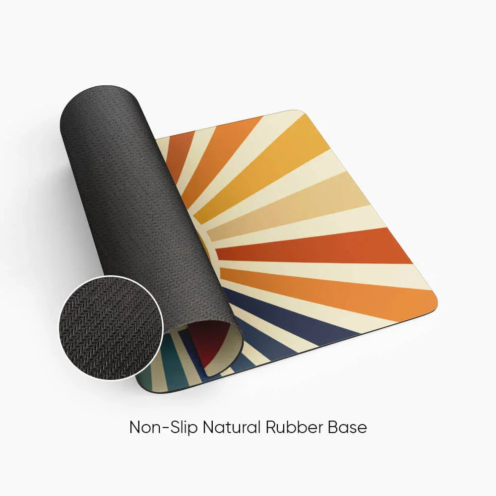 Desk mat with retro sunburst design and non-slip natural rubber base, close-up texture inset