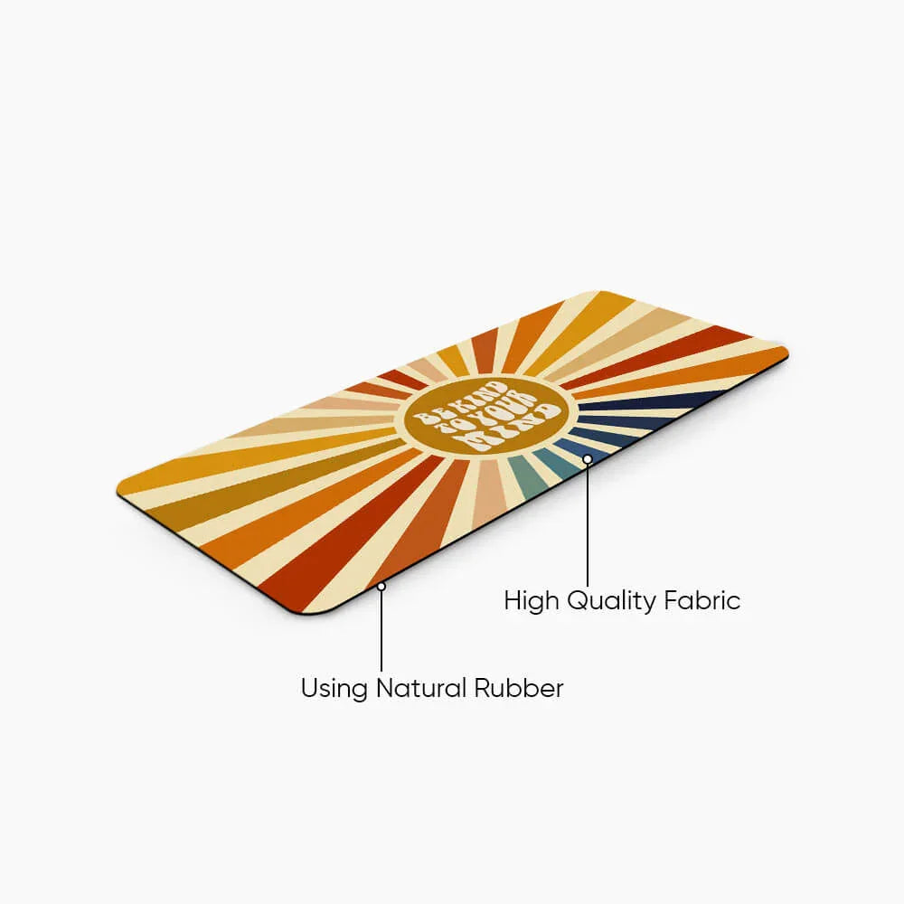 Retro desk mat with colorful sunburst pattern and 'Be Kind to Your Mind' text, high quality fabric, natural rubber base