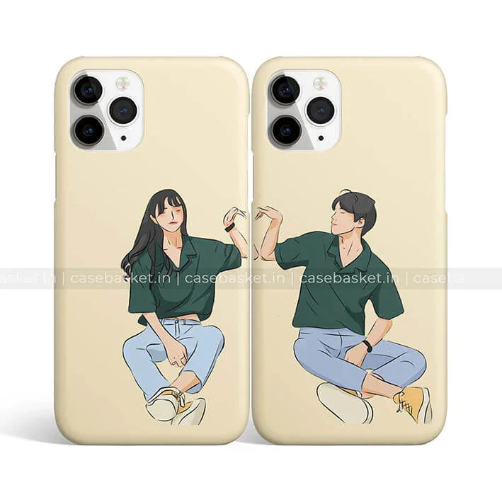 Matching couple phone cases with cartoon boy and girl illustration in casual outfits