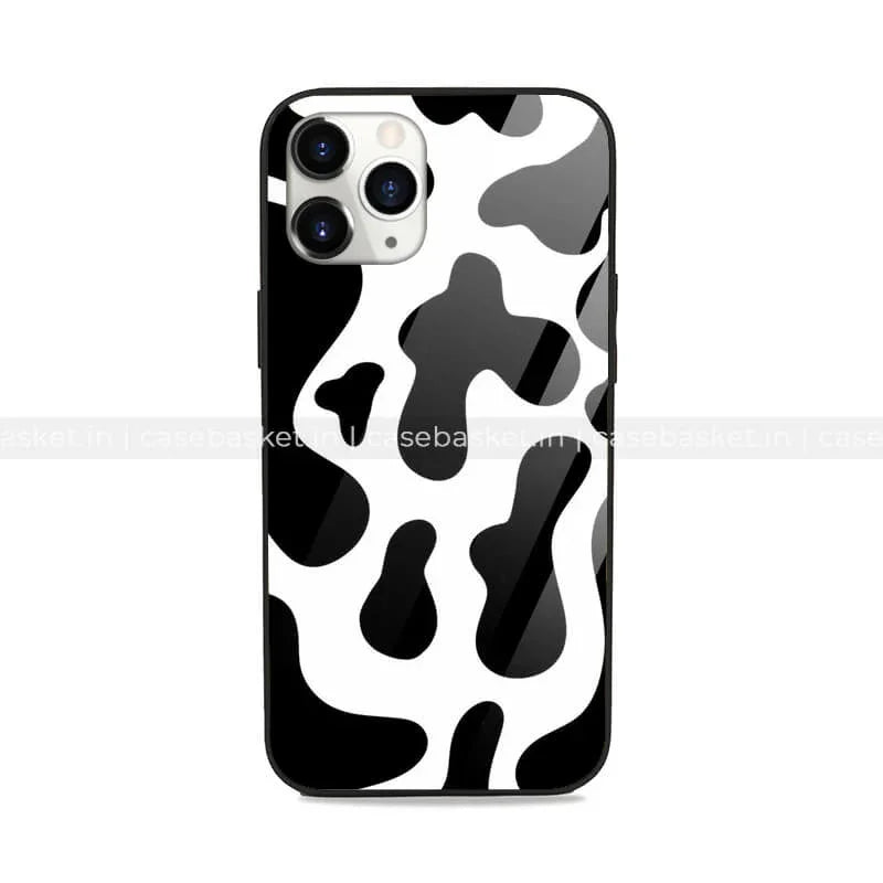 Black and white cow print phone case for iPhone with glossy finish, trendy animal pattern