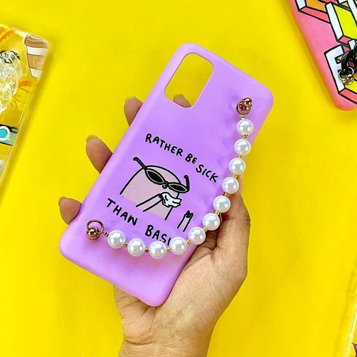 Purple phone case with cartoon and pearl chain, text reads 'Rather be sick than basic', held in hand