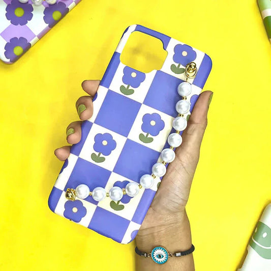 Blue and white checkered phone case with purple flower design and pearl chain charm