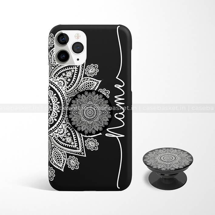 Jet black phone case with white mandala design and matching pop socket, customizable name.