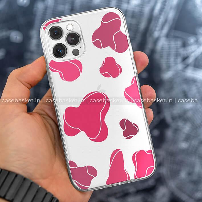 Clear phone case with abstract pink shapes design held in hand
