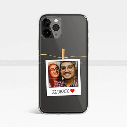 Black phone case with a custom polaroid photo design, personalized date, and heart graphic.