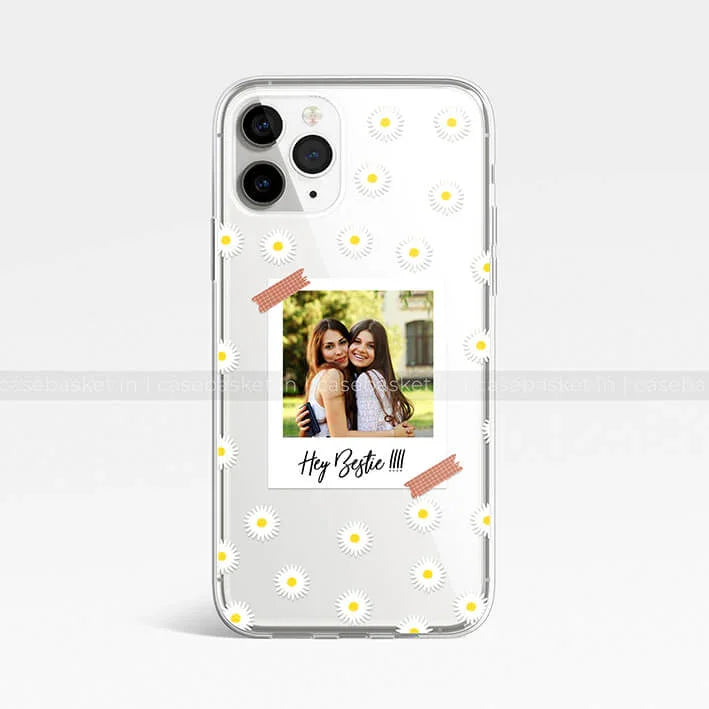 Clear phone case with daisy pattern and Polaroid-style best friends photo, Hey Bestie text