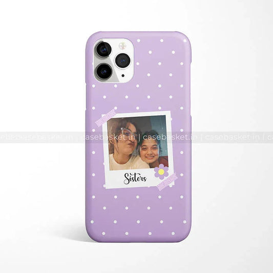Purple polka dot phone case with a polaroid photo design labeled 'Sisters'.