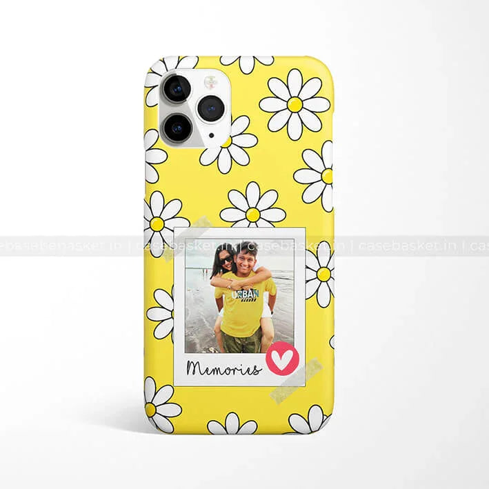 Yellow phone case with white daisy pattern and polaroid-style photo frame design