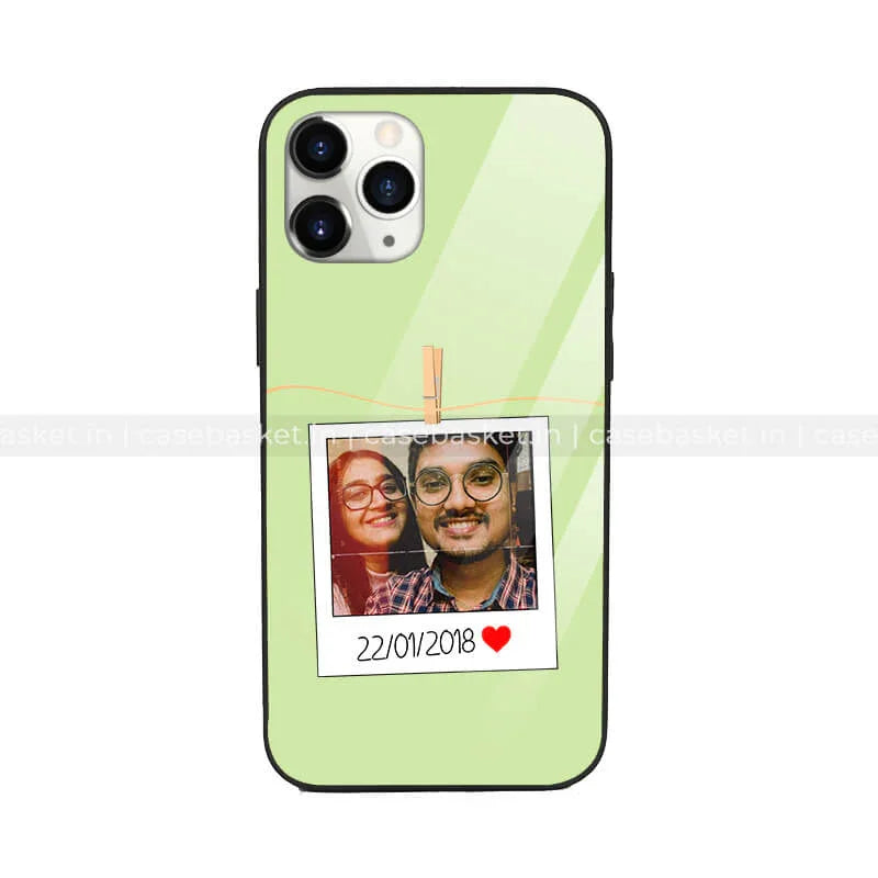 Green mobile case with polaroid-style photo and date design, protective phone cover