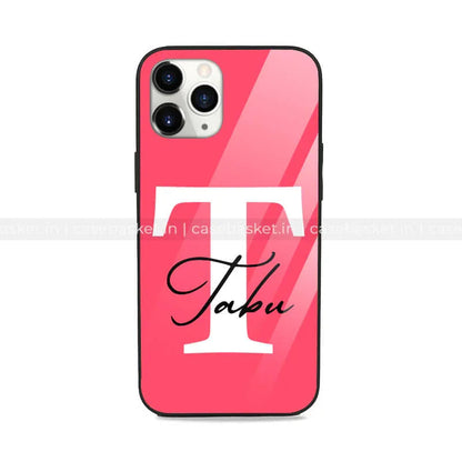 Glossy pink phone case with large white T and Tabu text, stylish mobile cover design.